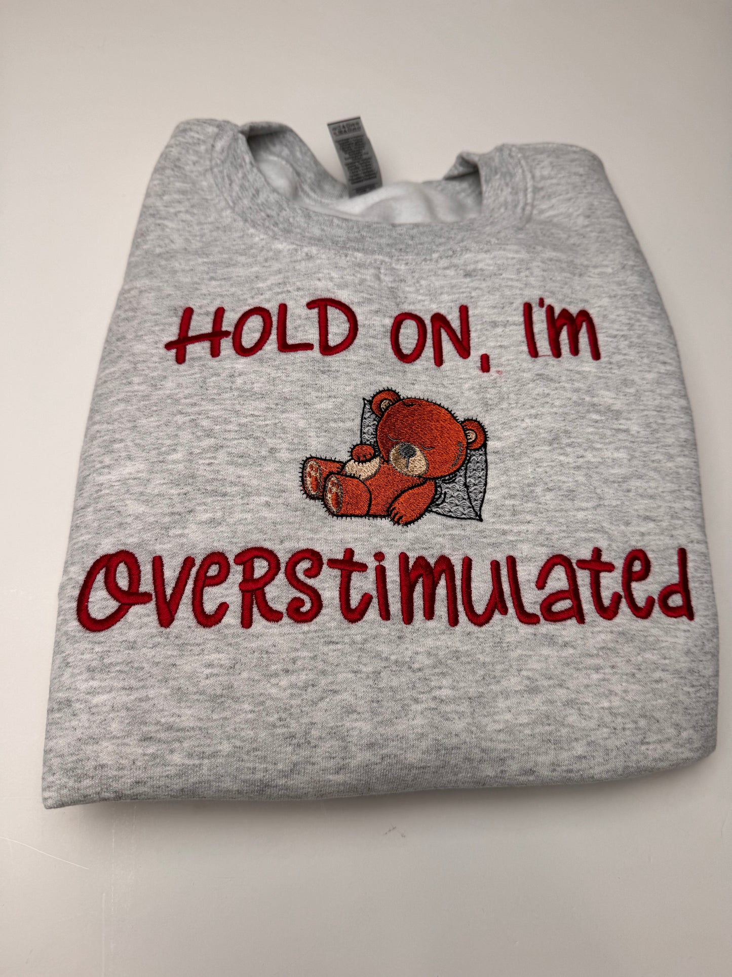 Embroidered Hold on I'm Over Stimulated Sleepy Bear Crewneck Sweatshirt