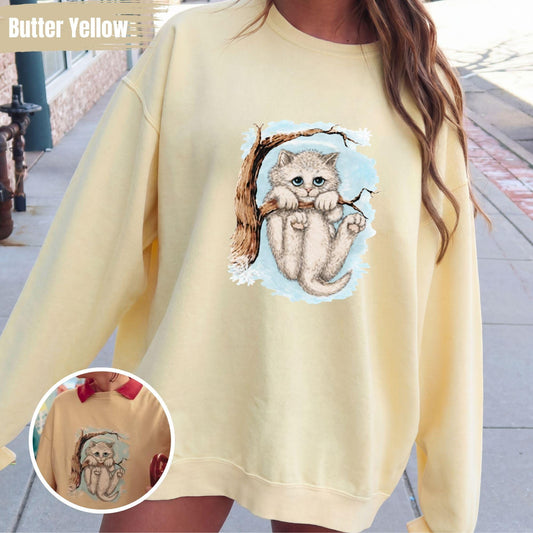 Opalite Winter Kitten In Snow holding Tree Crewneck Unisex Sweatshirt Vintage distressed Cat Yellow Opalite Shirt Crazy Cat hanging on